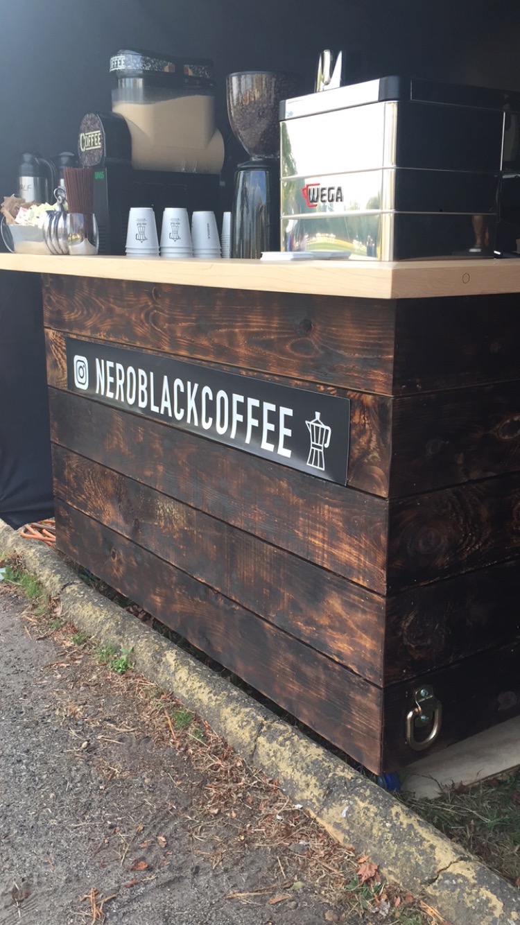 Nero Black Coffee at night with signage
